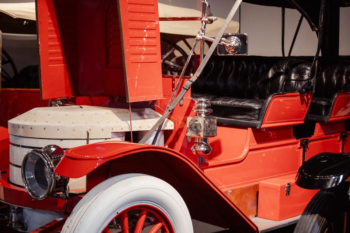 Red touring car, white-wall and brass